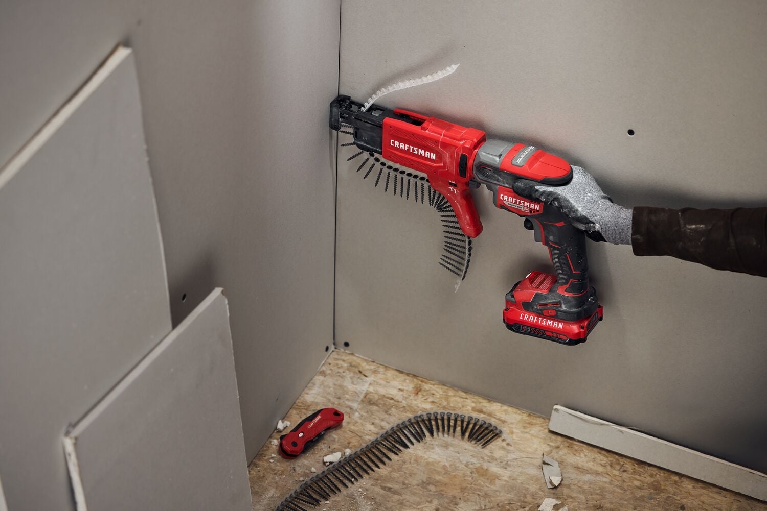 Craftsman V20 Brushless RP Drywall Screwgun fastening into drywall using collator attachment