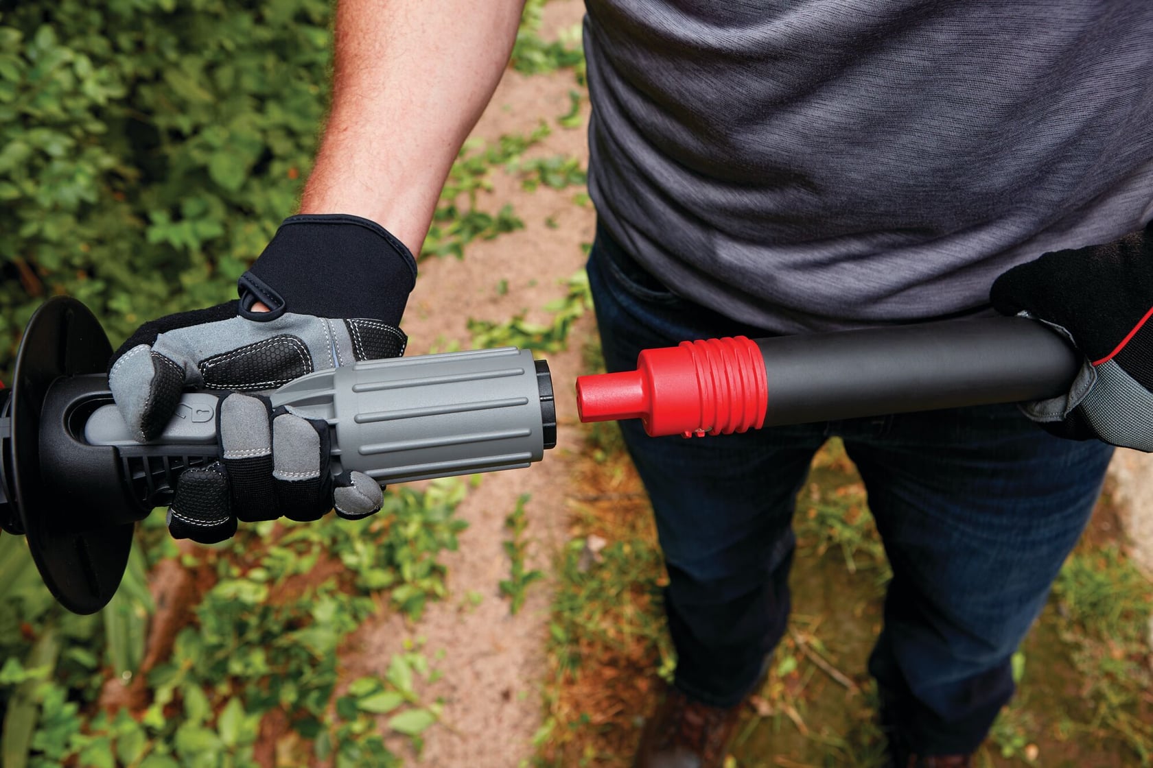 Padded grip and 180 degree pivoting head feature of 20 volt 18 inch cordless pole hedge trimmer kit.