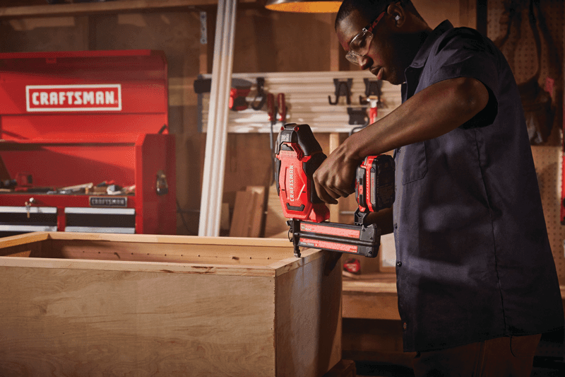 20 volt 18 gauge cordless brad nailer kit being used by a person indoors.