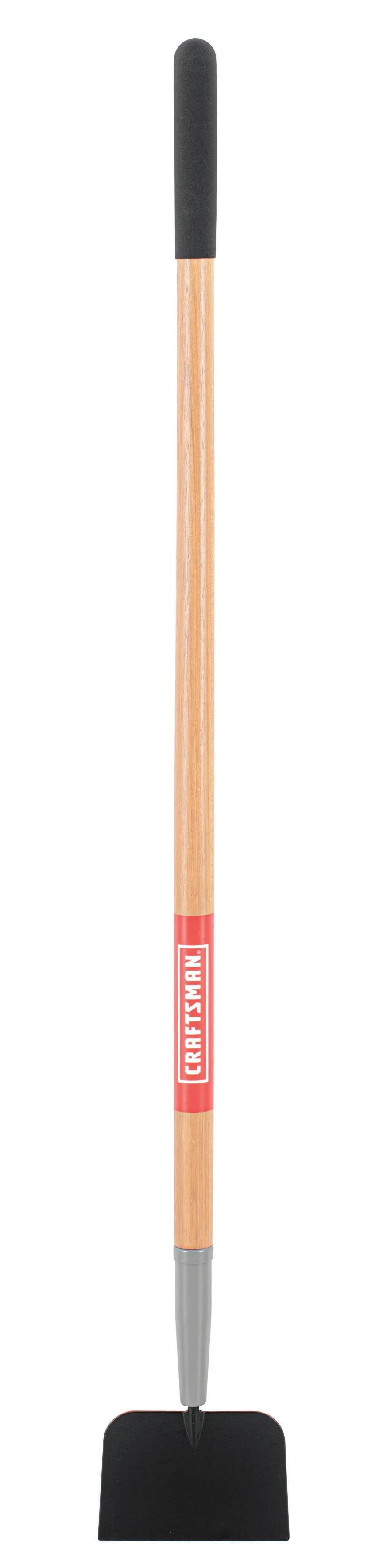 A garden hoe with a wooden handle and a black metal blade, photographed against a white background.