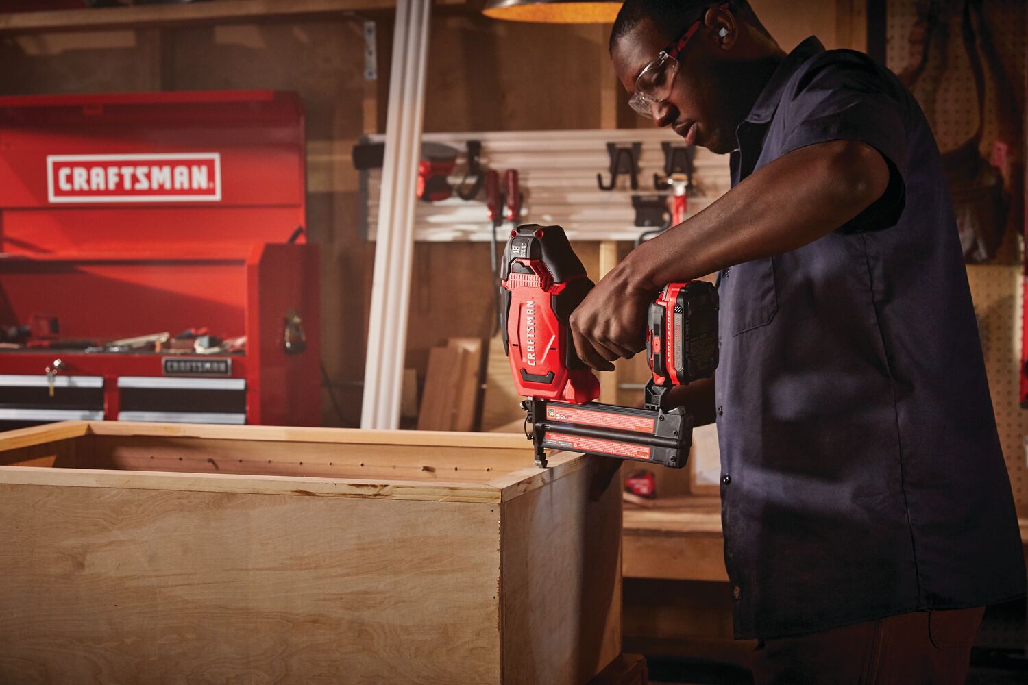 20 volt 18 gauge cordless brad nailer kit being used by a person indoors.
