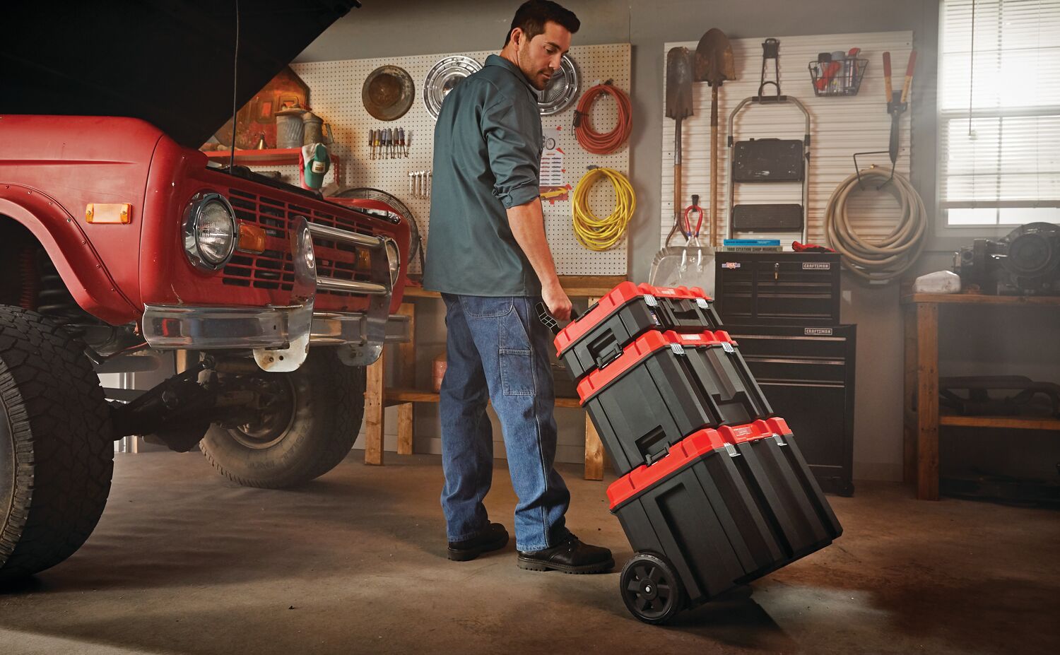 Person carrying VersaStack System Tower for use in workshop.