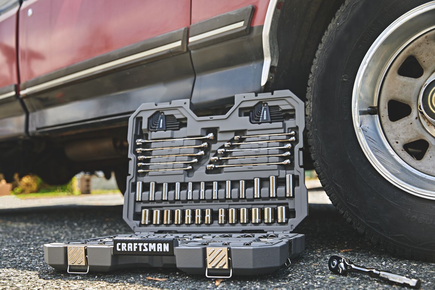 CRAFTSMAN OVERDRIVE 121 piece mechanics tool set on ground in front of vehicle
