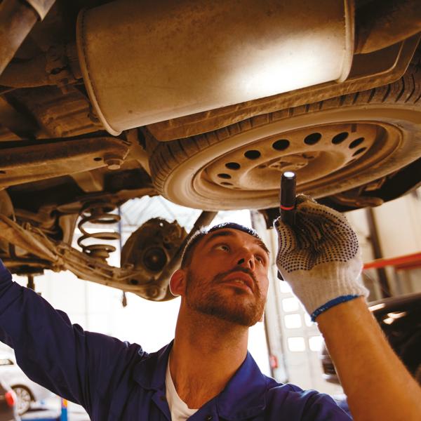 2 piece 80 lumens pen light set being used by a person to fix a tyre.