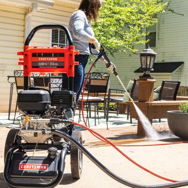 pressure washing outdoor patio of FNA pressure washer (CMXGWFN061255)
