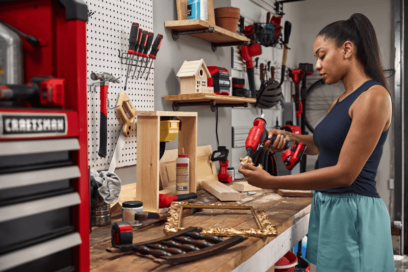 Woman fixing broken picture frame with the CRAFTSMAN� V20* Standard Full Size Glue Gun
