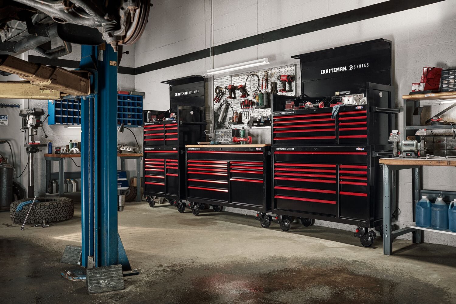 Photo of Craftsman black and red tool chest CMSTVS6311BK in a garage with various tools and equipment.