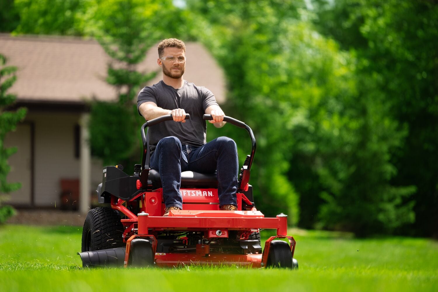 Man riding CRAFTSMAN Z3200 Gas Zero-Turn