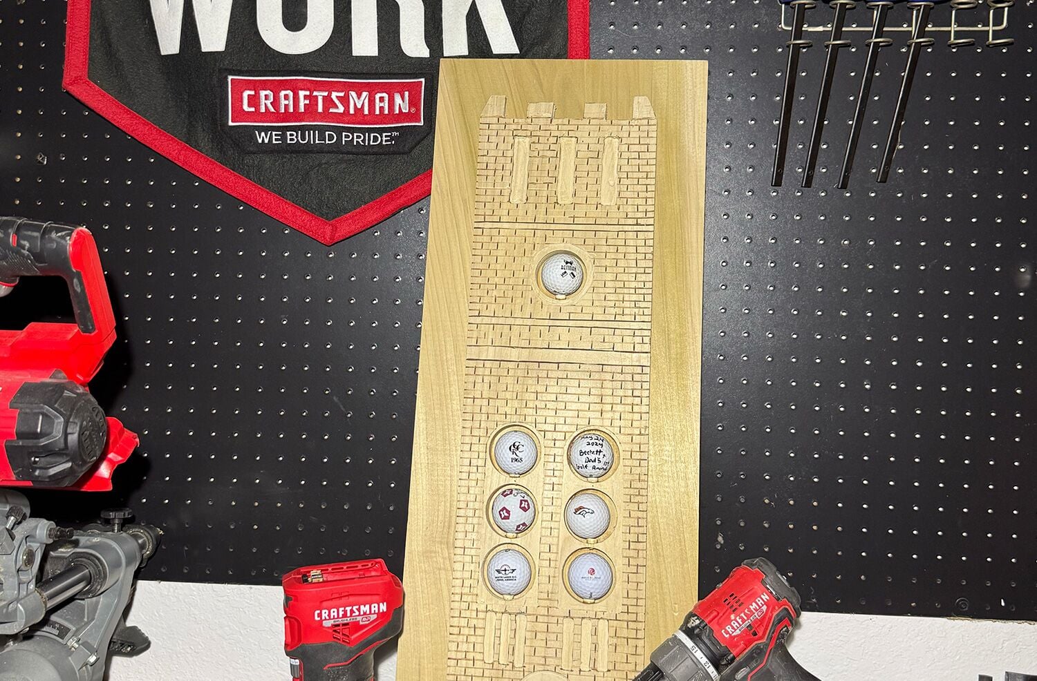 a wooden golf ball and tee holder against a black background