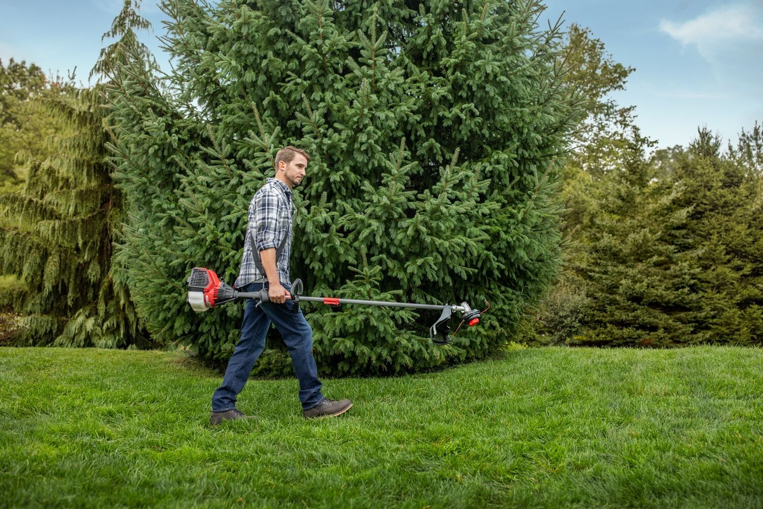 CRAFTSMAN WS4200 WEEDWACKER being carried across yard with plaid shirt