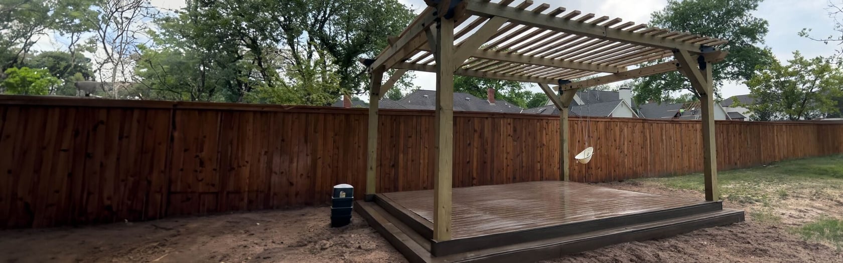 Photo of a wooden pergola with open slatted roof on a raised deck in a backyard, Craftsman, BrandWebsites.