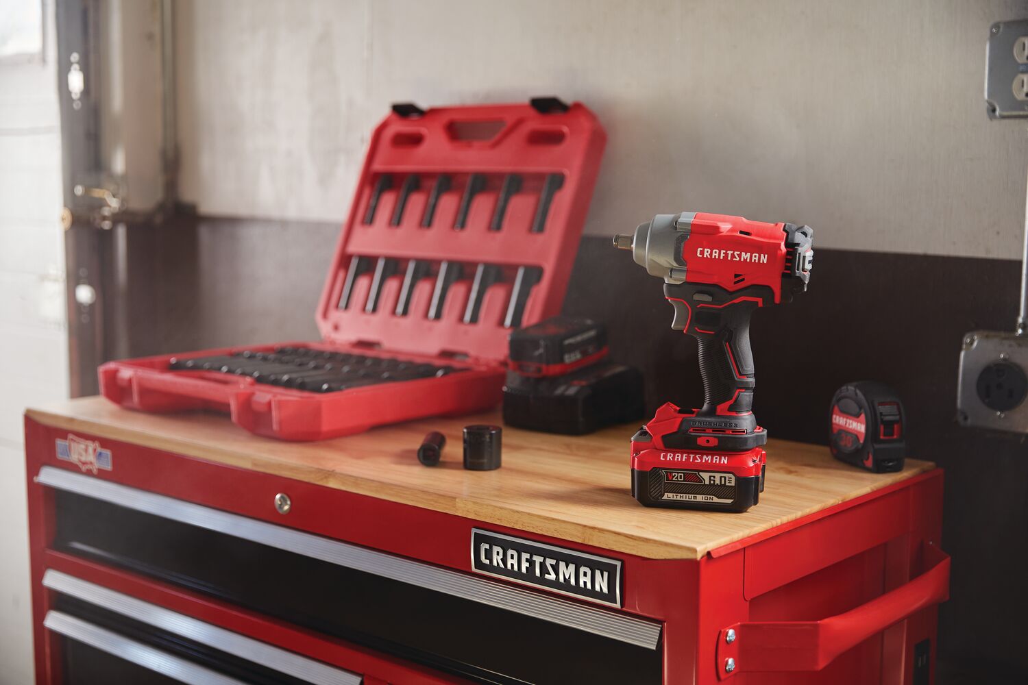 Half inch drive brushless cordless impact wrench placed of craftsman tool table.